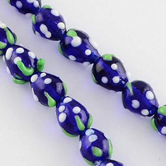 10 x handmade strawberry glass lampwork beads, dark blue with white & green decoration, approximately 16mm x 11mm, drilled 2mm hole